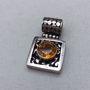 Silver and topaz pendant